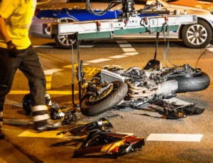 Motorcycle accident scene with paramedics