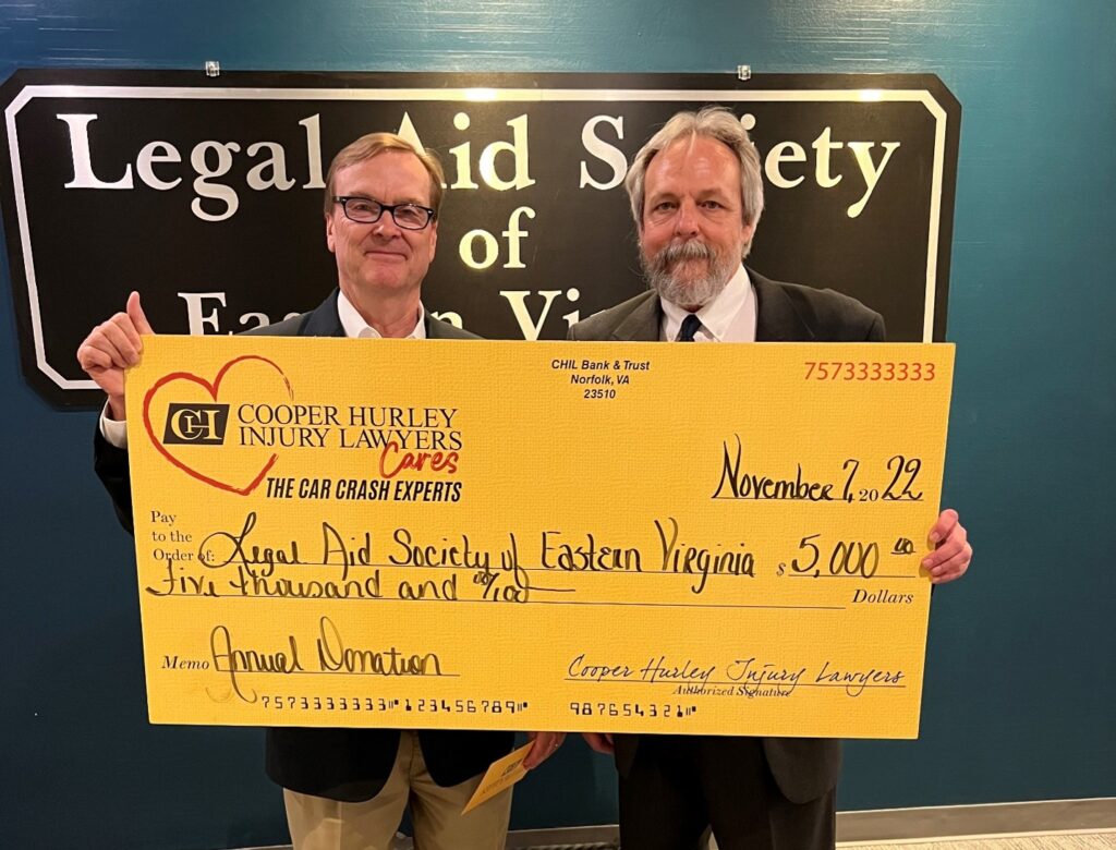 Donating check to Legal Aid Society of Eastern Virginia