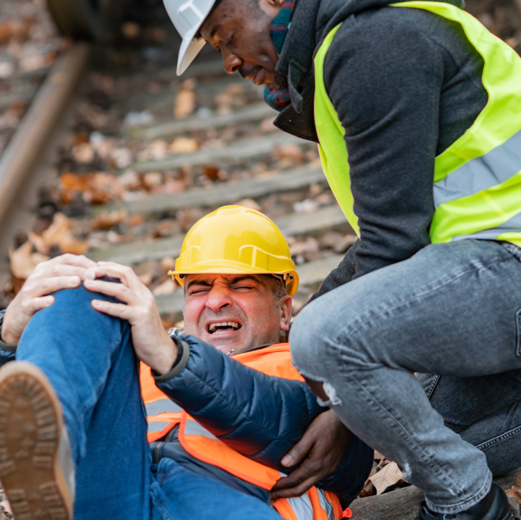 injured construction worker on railroad track