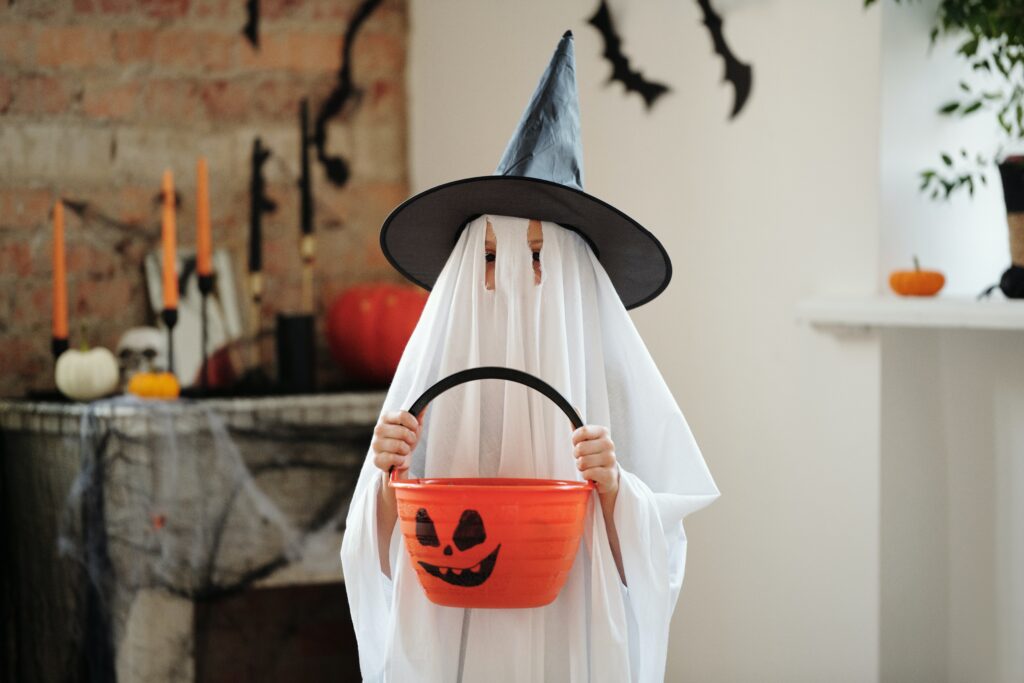 Kid in ghost costume for Halloween