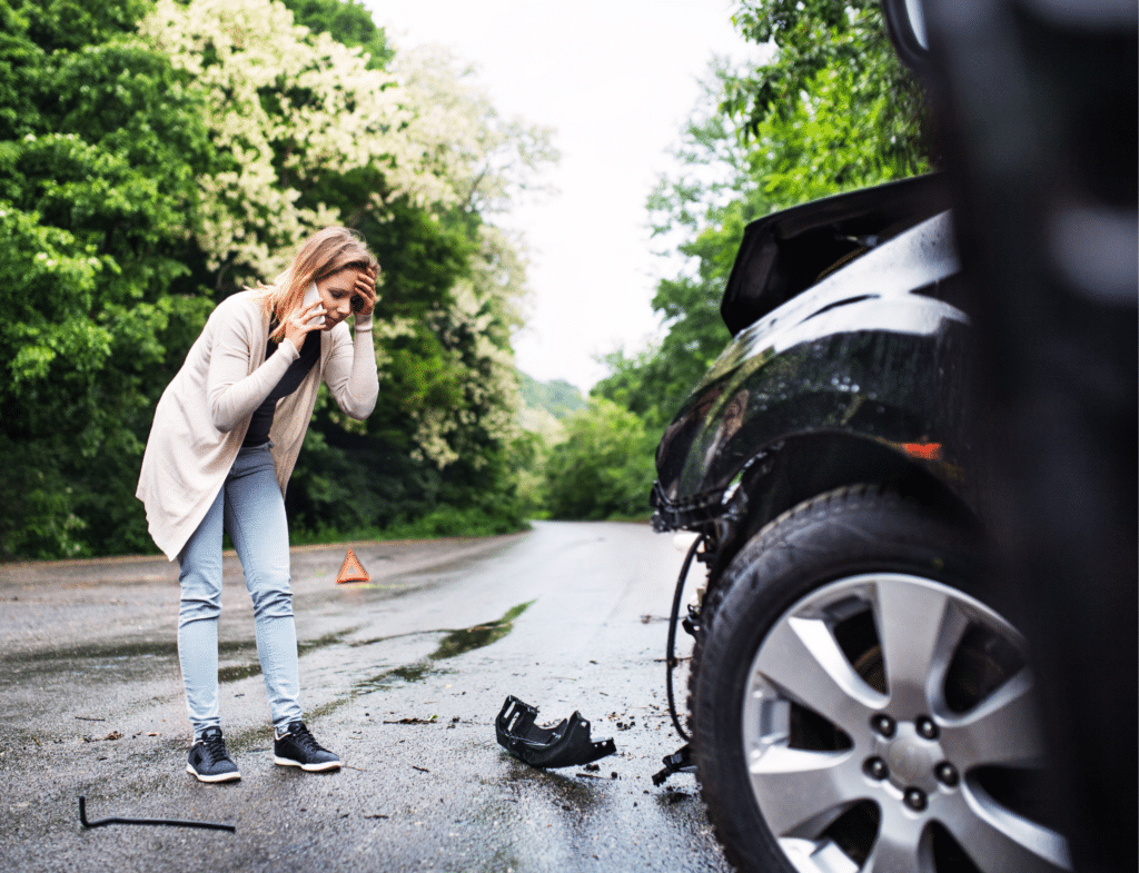 Woman on phone after car accident