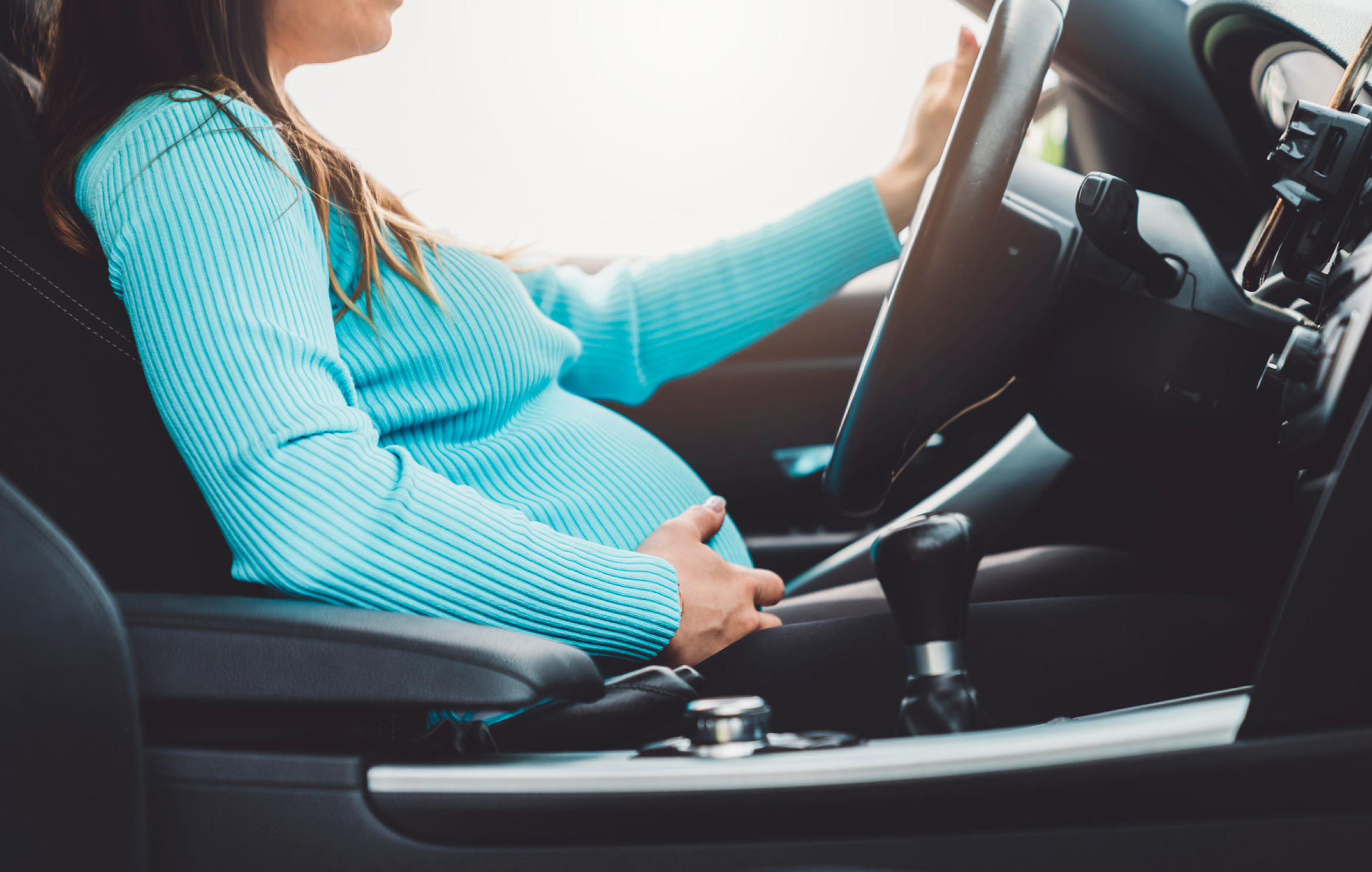 A pregnant woman driving
