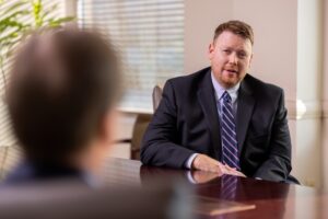 Bill O'Mara at conference table