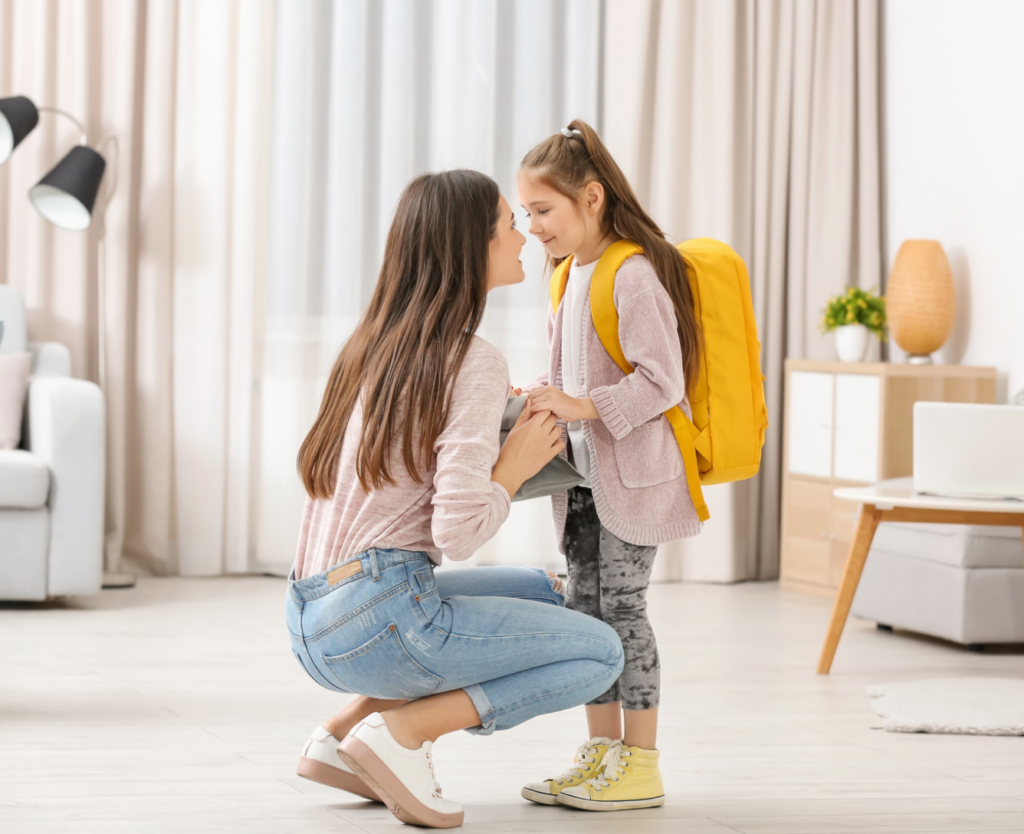mother with daughter ready to leave for school