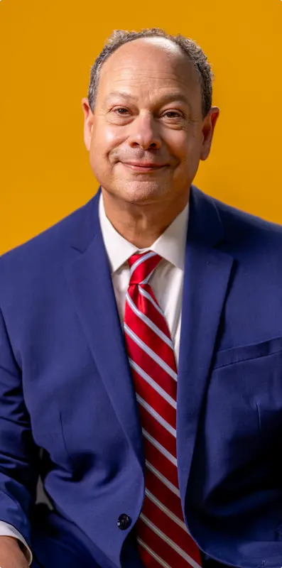 Picture of John Cooper in a suit and tie
