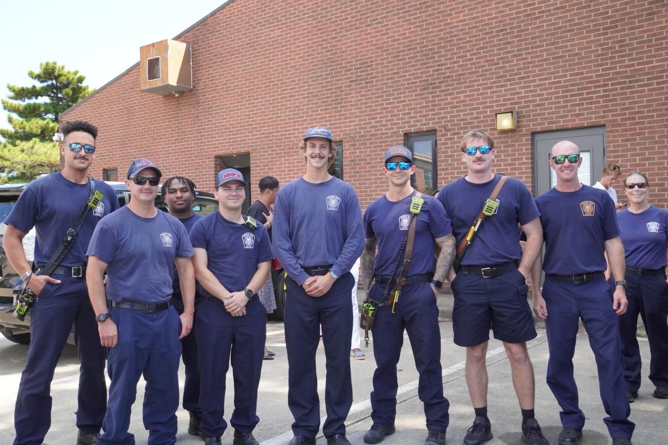 Group photo of Cooper Hurley Injury Lawyers attorneys and staff standing together in the office.