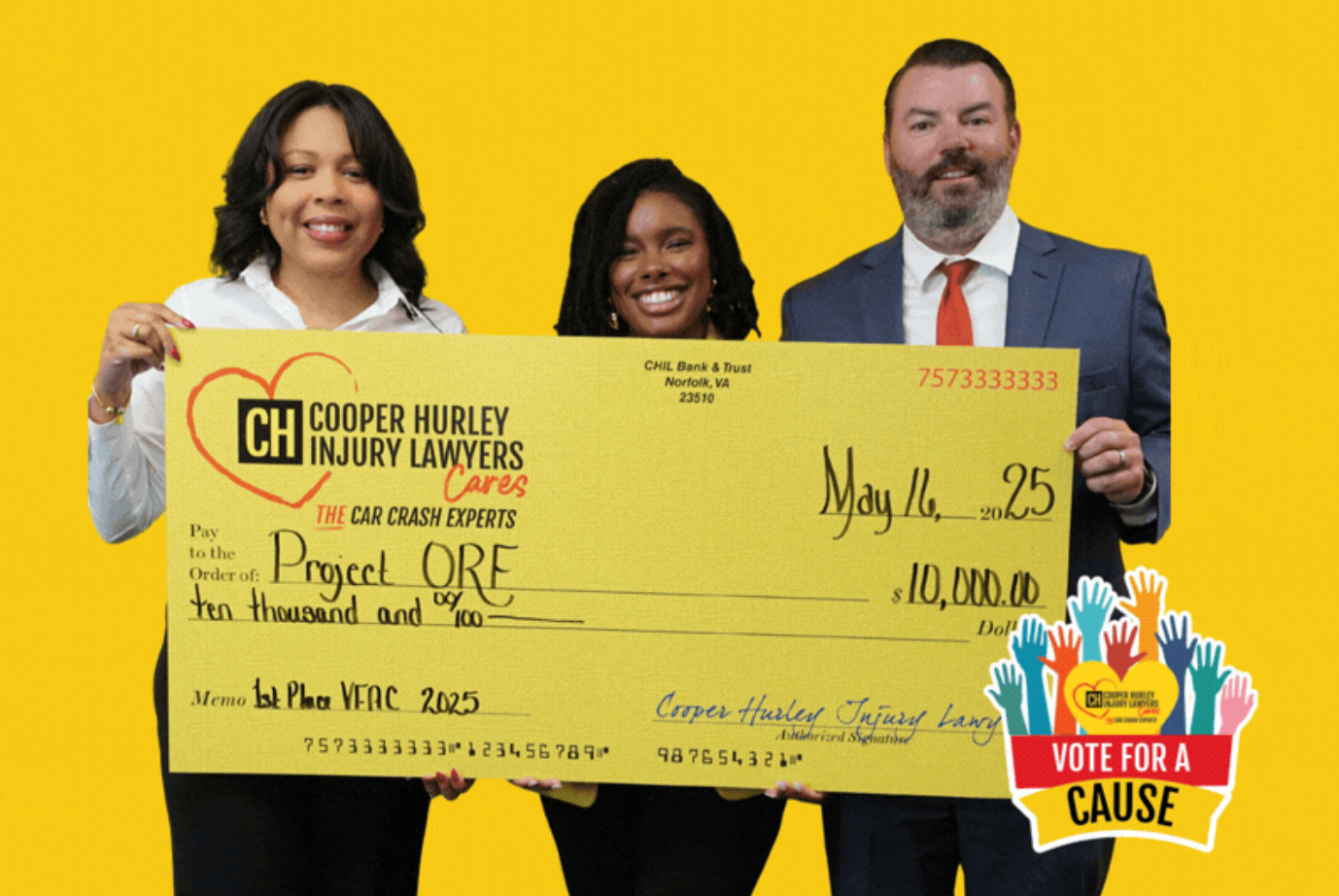 cooper hurley team holding donation check